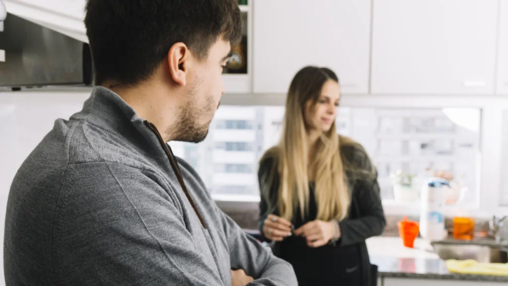Man and woman having a conversation in a modern kitchen